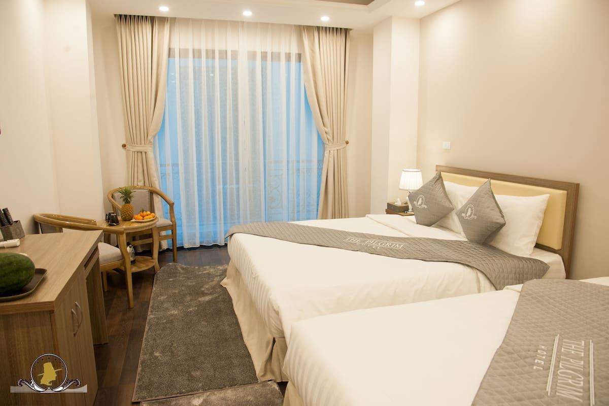 Family Triple Room, Balcony, City View | Minibar, in-room safe, desk, free WiFi
