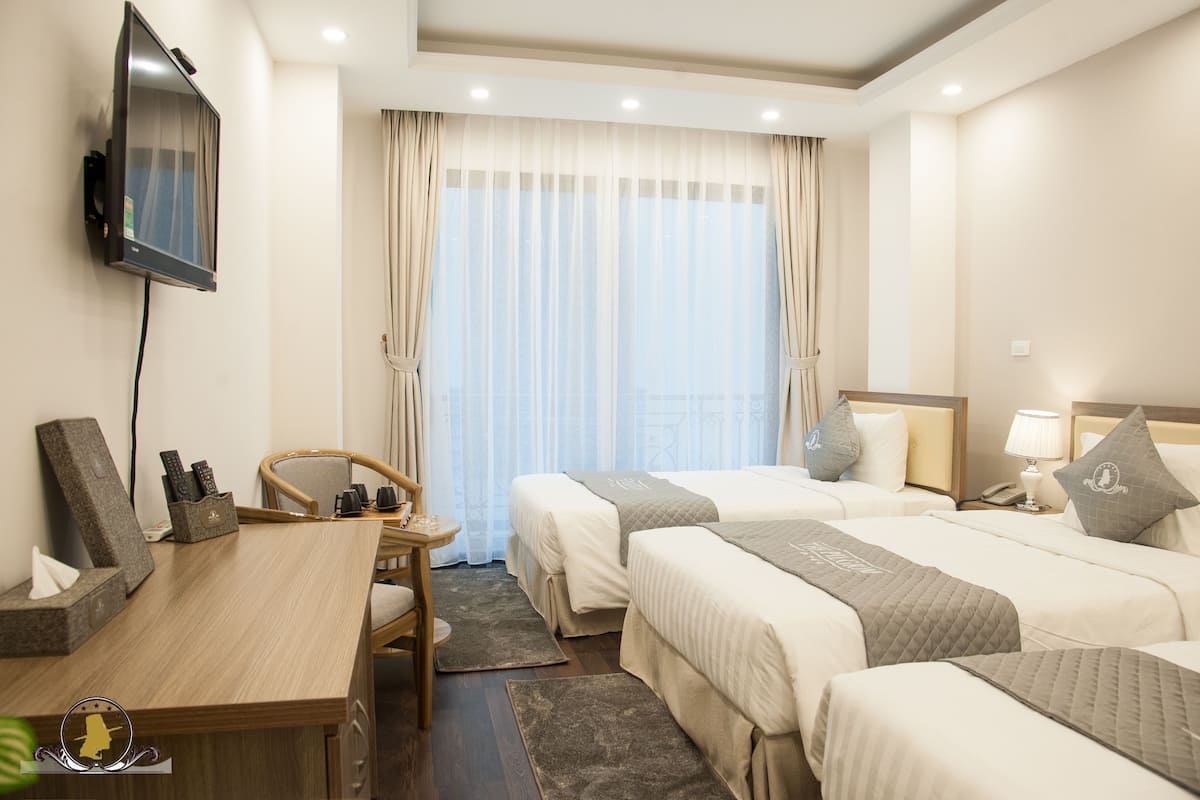 Deluxe Triple Room, Balcony, City View | Minibar, in-room safe, desk, free WiFi