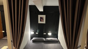 A room with a bed, curtains, and two bedside lamps labeled G2 and G3. - 84 Gallery - Hostel (Chiang Mai)