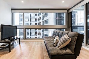 Apartment, 1 Bedroom, Balcony, City View | Living area | Flat-screen TV - ALY Property Group Apartments (Melbourne)
