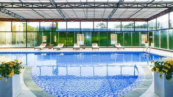Indoor pool, open 6:00 AM to 8:00 PM, pool loungers