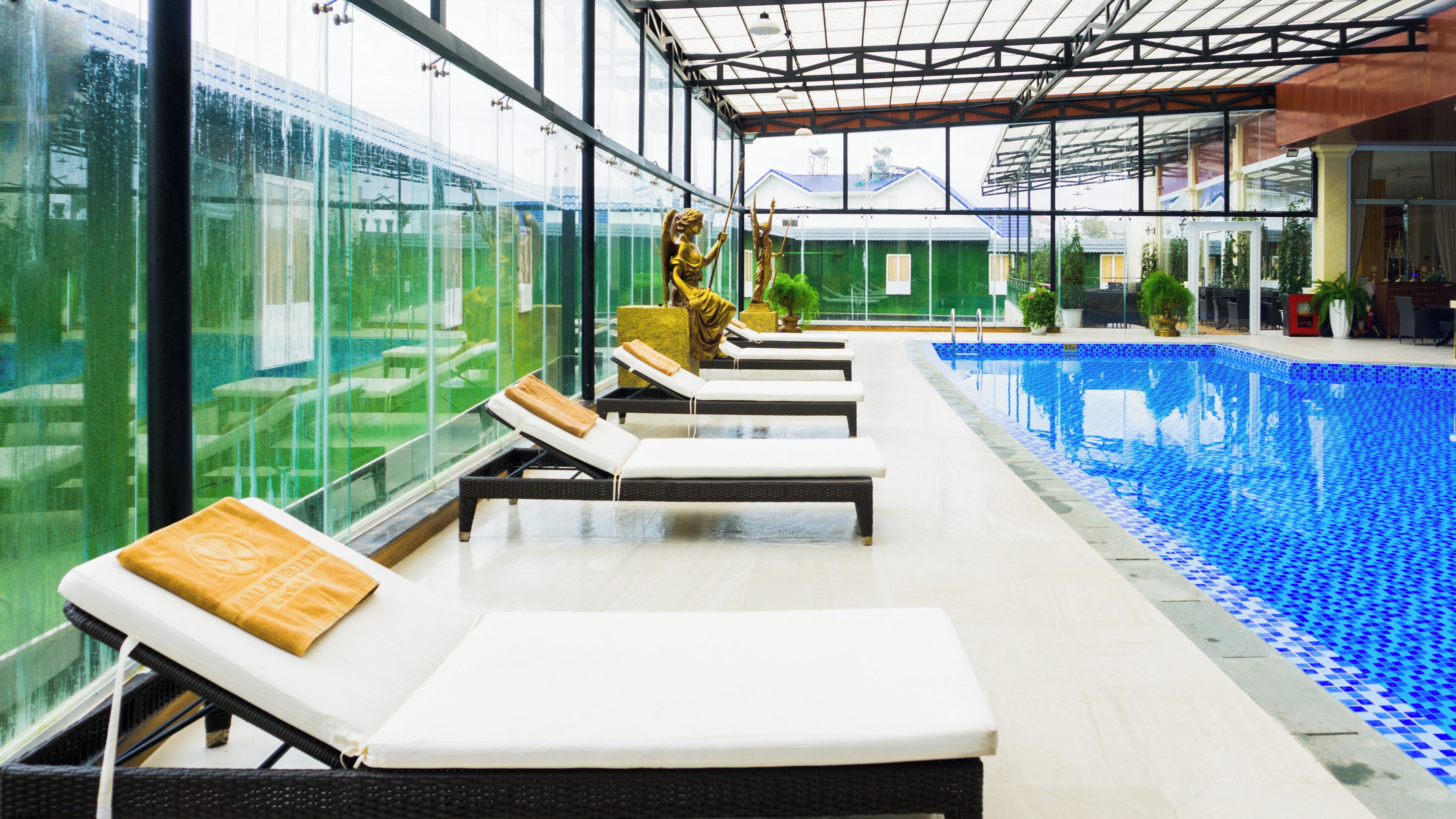 Indoor pool, open 6:00 AM to 8:00 PM, pool loungers