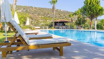 Seasonal outdoor pool, pool umbrellas, pool loungers