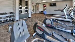 A gym with treadmills, ellipticals, and dumbbells. - Fairfield Inn & Suites by Marriott Albuquerque North (Albuquerque)