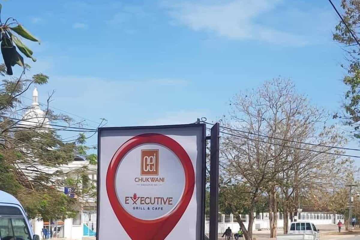 A signboard for Chukwani Executive Grill & Cafe.