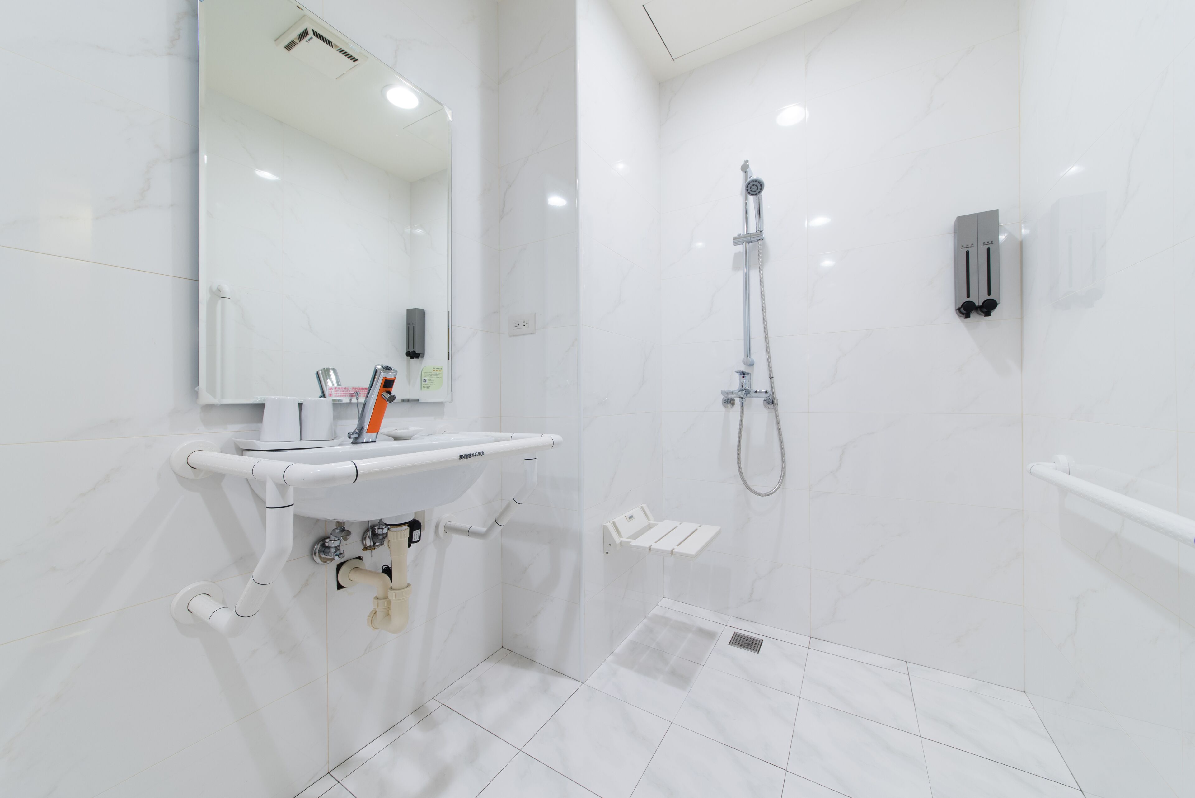 standard twin room, accessible | bathroom | shower, rainfall showerhead, hair dryer, towels