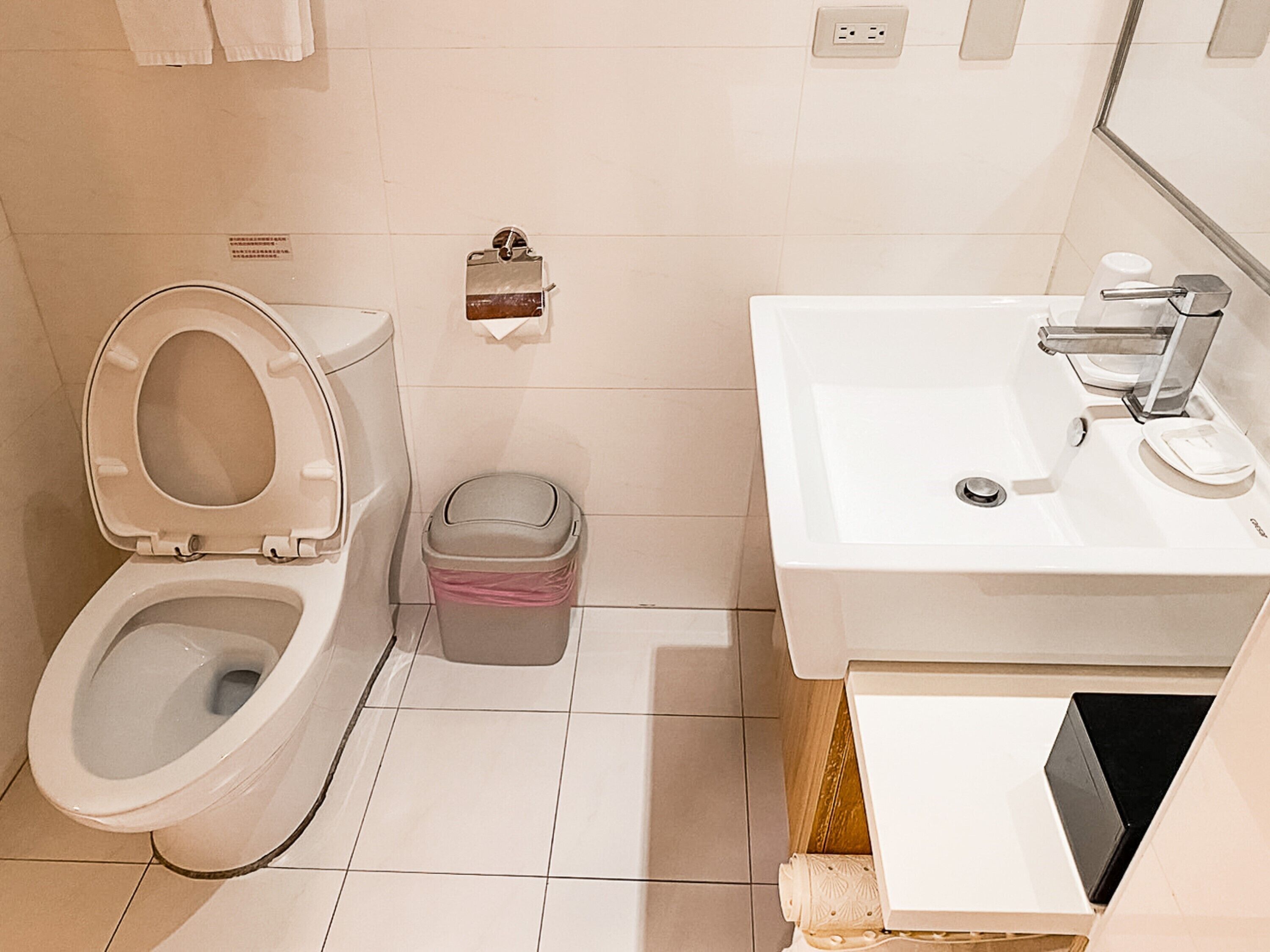 deluxe twin room | bathroom | shower, rainfall showerhead, hair dryer, towels