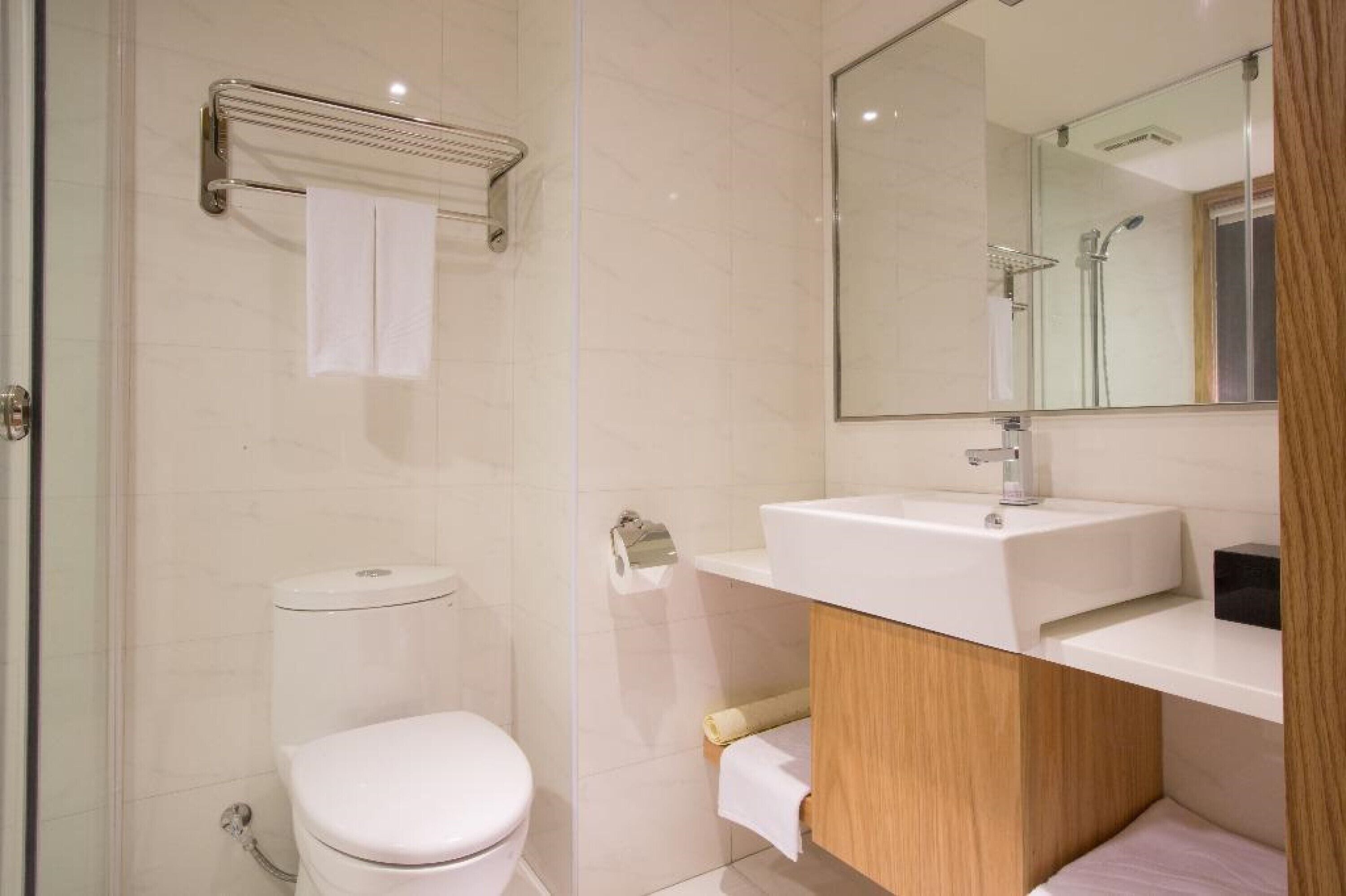 standard twin room | bathroom | shower, rainfall showerhead, hair dryer, towels