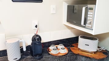 4 Bedroom Family House | Private kitchen | Full-sized fridge, microwave, oven, stovetop