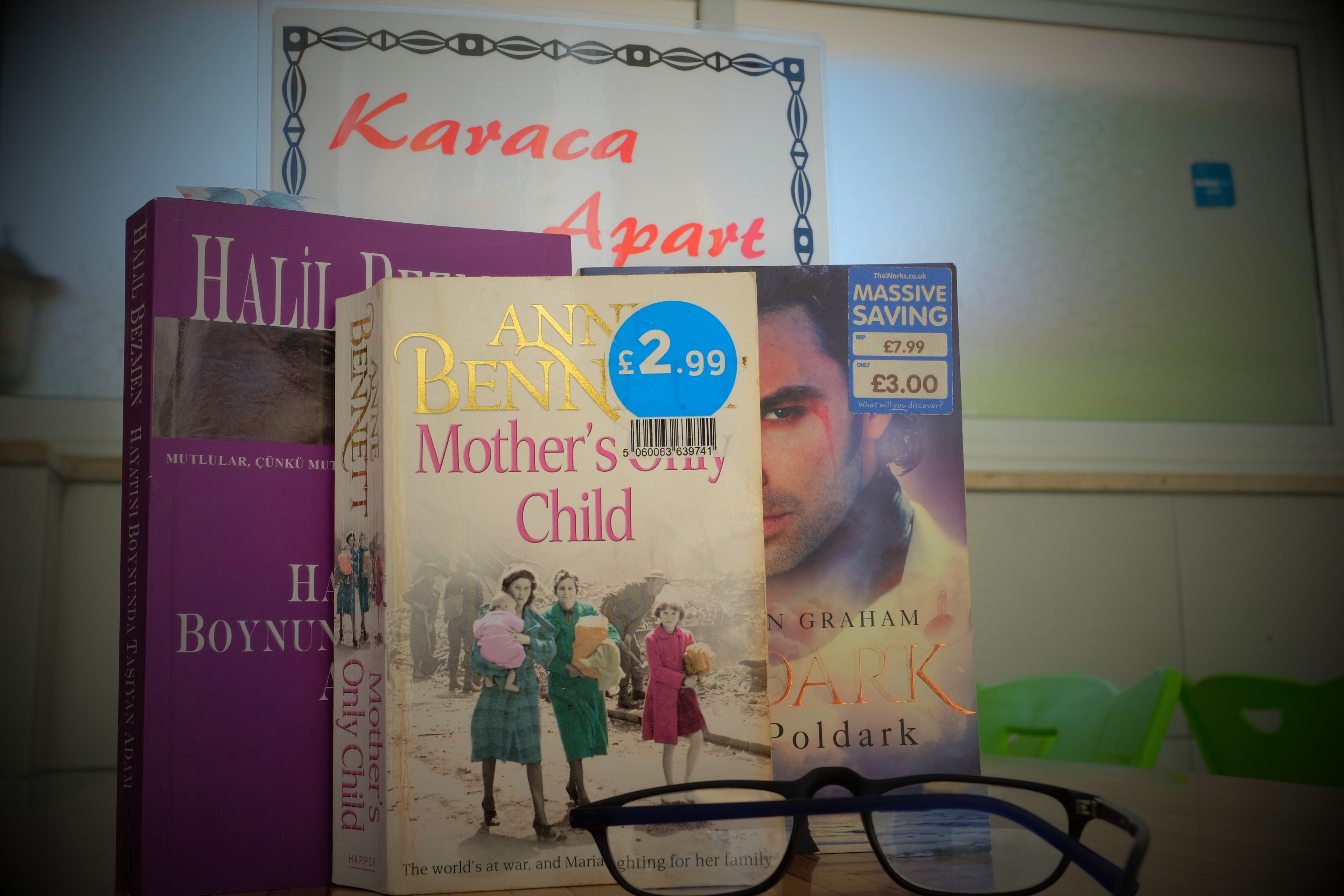 A stack of books with a price tag of £2.99.