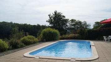 Seasonal outdoor pool, open 10 AM to 7 PM, pool umbrellas, pool loungers