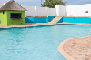 Outdoor pool, pool umbrellas, pool loungers