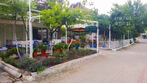 A hotel named "HOTEL SERIL" with outdoor seating and potted plants. - Hotel Seril 1 (Fethiye)