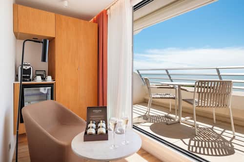 Junior Suite, Balcony, Sea View | Premium bedding, minibar, in-room safe, blackout curtains