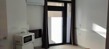 Apartamento | Zona de estar | Una televisión de pantalla plana