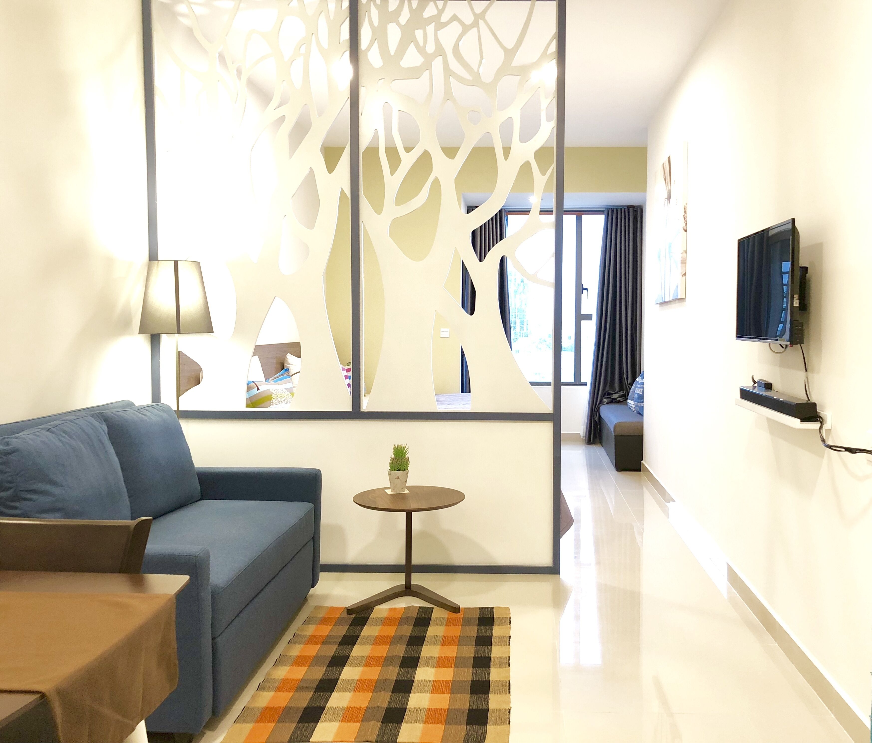 Apartamento, vista para a cidade | Área de estar | TV de tela plana