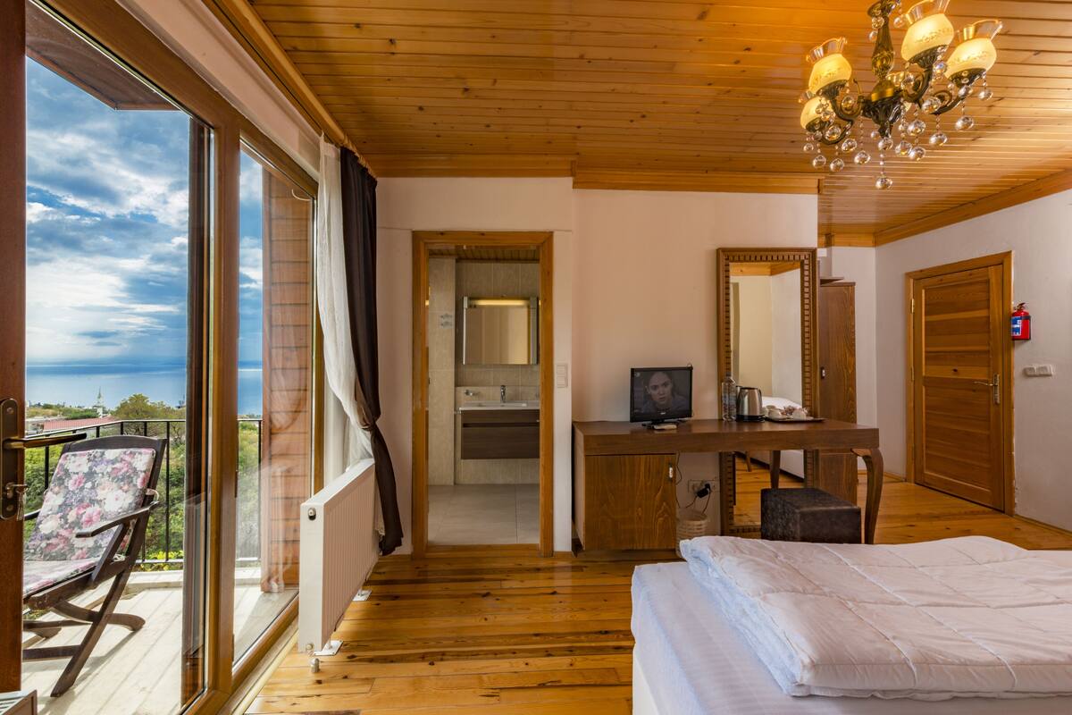 Chambre Deluxe, cheminée, vue mer