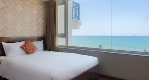Deluxe Quadruple Room | Living area | 24-inch flat-screen TV with cable channels, TV - Le Soleil Hotel Nha Trang (Nha Trang)