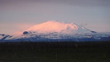A snow-capped mountain with a clear sky.