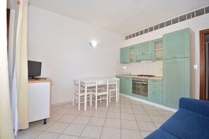 Apartment, 1 Bedroom | Private kitchen | Full-sized fridge, oven, stovetop, cookware/dishes/utensils