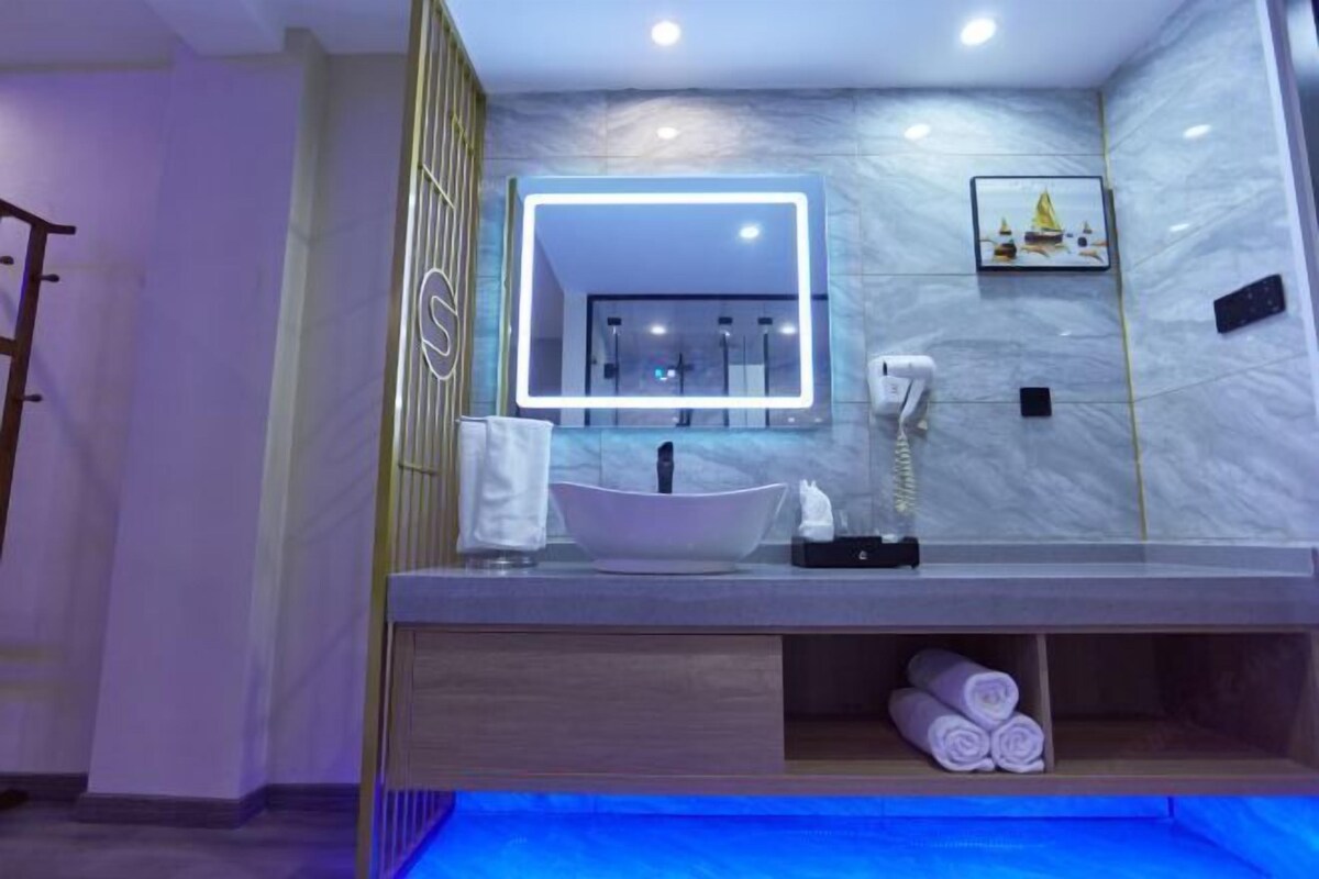 Shower, free toiletries, slippers, towels