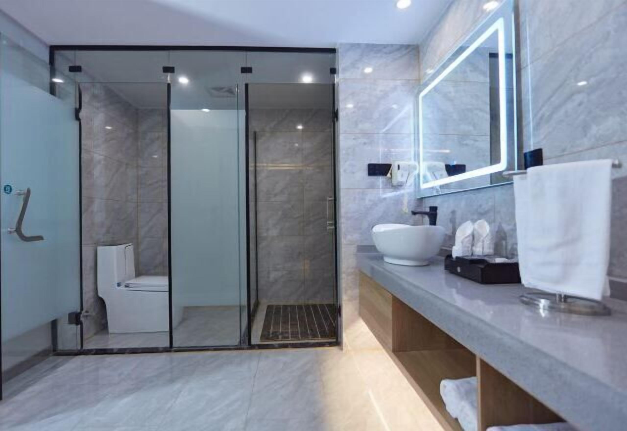 Shower, free toiletries, slippers, towels