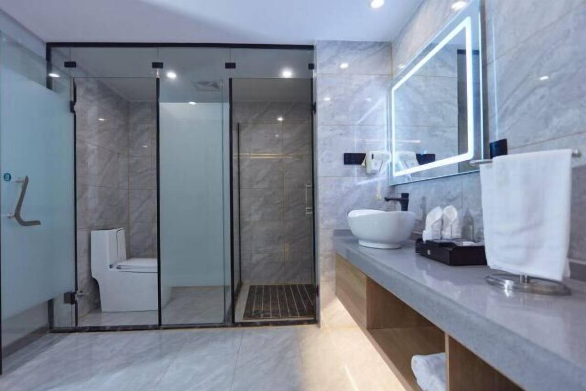 Shower, free toiletries, slippers, towels