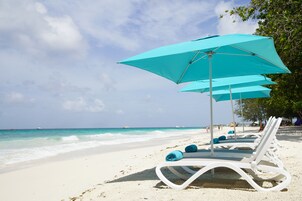 Beach nearby, white sand, sun loungers, beach umbrellas