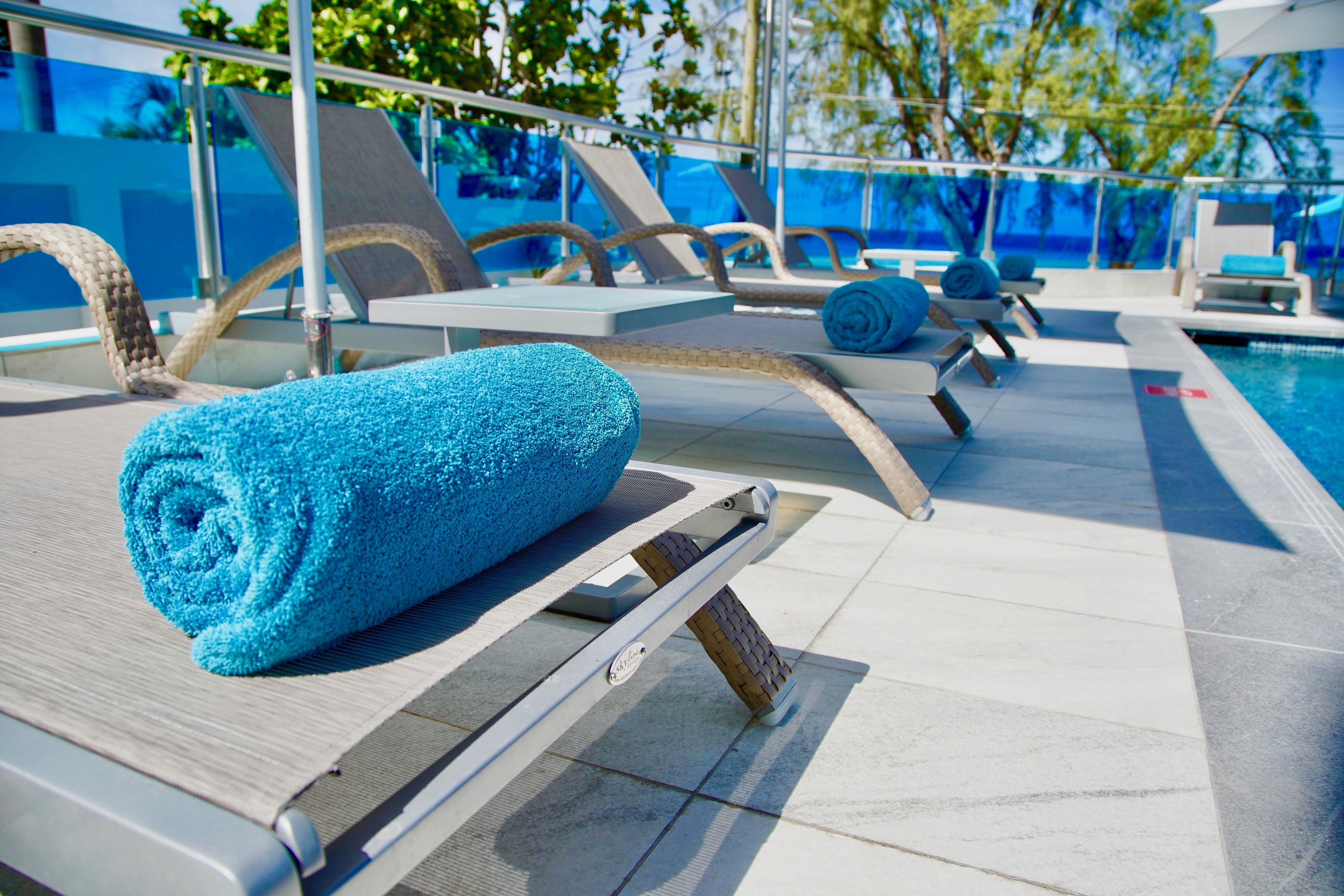 outdoor pool, open 7:00 am to 6:00 pm, pool umbrellas, pool loungers