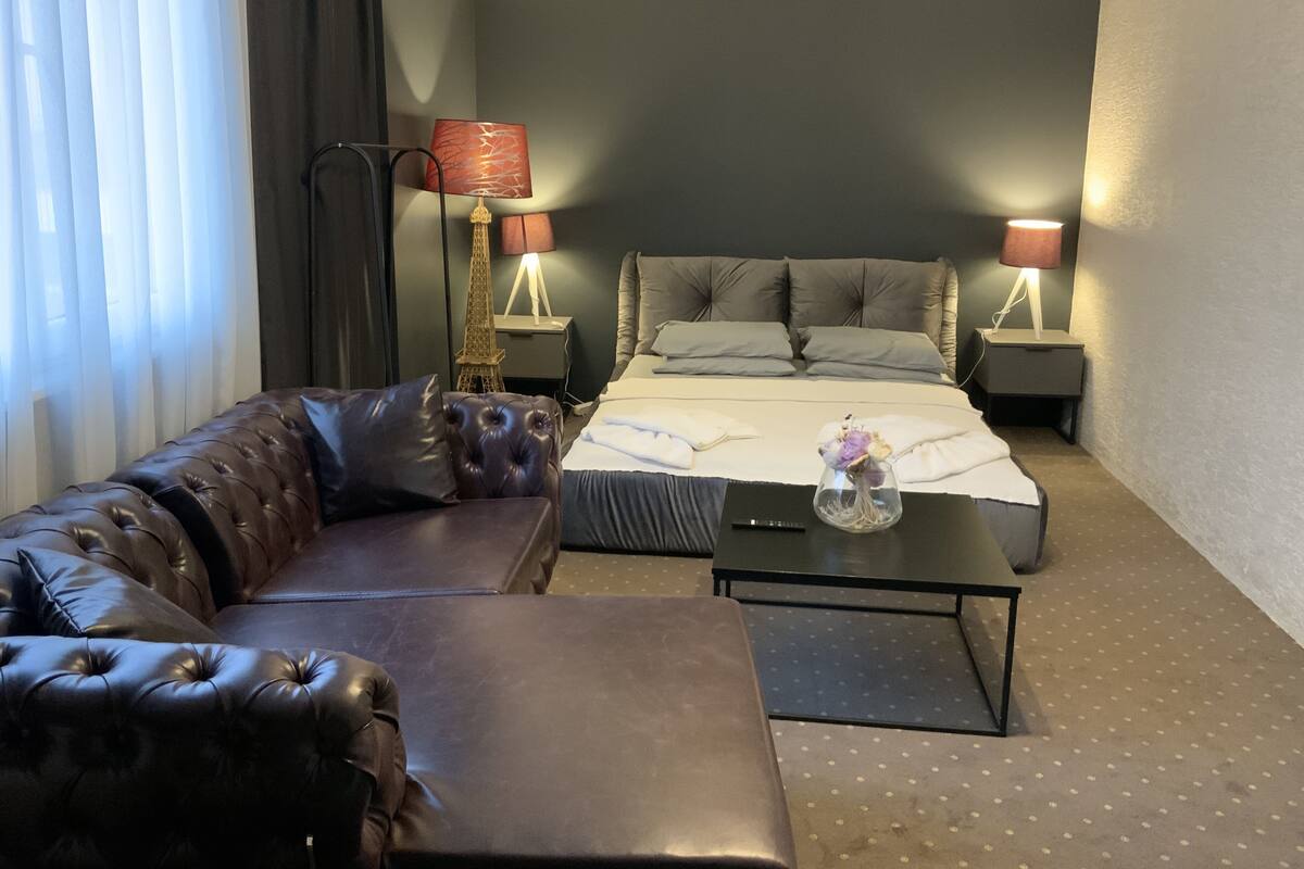Luxury Studio Suite | Premium bedding, desk, laptop workspace, blackout drapes