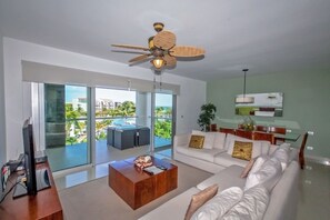 Exclusive Condo, 3 Bedrooms, Pool Access, Ocean View | Living area | Flat-screen TV, DVD player, iPod dock - Buena Vida by NAS (Playa del Carmen)