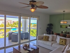 Exclusive Condo, 3 Bedrooms, Pool Access, Ocean View | Living area | Flat-screen TV, DVD player, iPod dock - Buena Vida by NAS (Playa del Carmen)