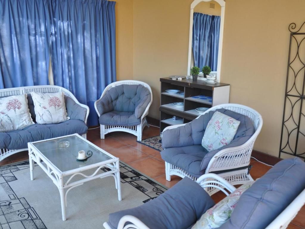 A living room with a sofa set, a coffee table, and a side table.