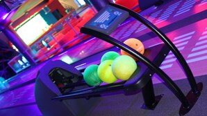 A bowling lane with a ball return system and a digital score display. - Hotel Nekla (Nekla)