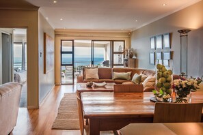 Deluxe Apartment, 3 Bedrooms, Ocean View, Oceanfront | Living room | Flat-screen TV, DVD player - The Lookout at Whale Cove (De Kelders)