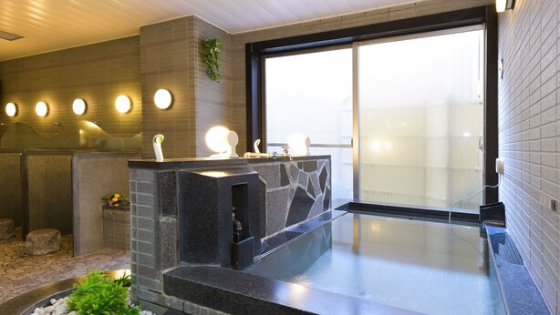 A modern bathroom with a stone sink, a built-in hot tub, and a large window. - Refre Forum (Tokyo)