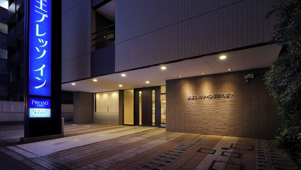A hotel entrance with a prominent sign, a tiled facade, and a well-lit entrance area. - Keio Presso Inn Kudanshita (Tokyo)