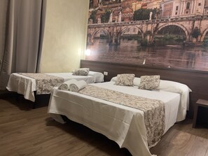 A hotel room with two beds, each with a patterned bedspread and pillows, a wooden floor, and a large wall mural of a bridge over water. - Albergo Corvetto corso Lodi (Milan)