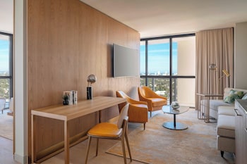 Suite, 1 Bedroom, Balcony | Living area | 55-inch LED TV with cable channels, TV, iPod dock at The Dalmar, Fort Lauderdale, a Tribute Portfolio Hotel