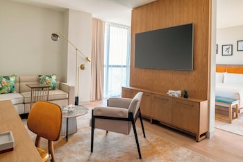 Suite, 1 Bedroom | Living area | 55-inch LED TV with cable channels, TV, iPod dock at The Dalmar, Fort Lauderdale, a Tribute Portfolio Hotel