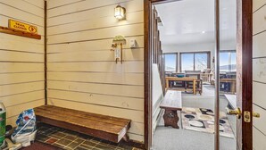 A sauna room with a wooden bench, a sign indicating the trail is closed, and a welcome sign. - Three bedroom Private home with Beautiful Views & Short Walk to the Home Stretch Trail! Frosty (Killington)