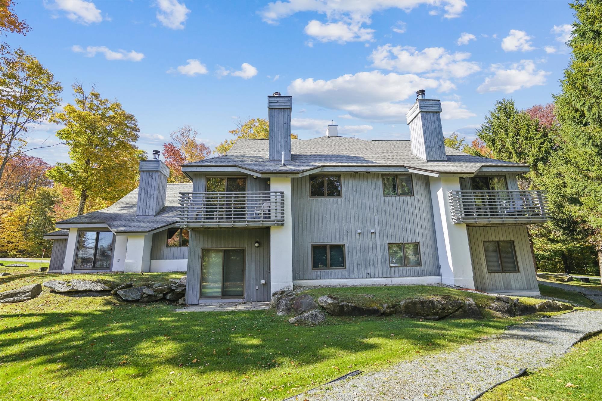 Mountain Living Surrounded by Fall Color - The property sits among trees and open green space, with beautiful Vermont foliage adding plenty of color in the fall.