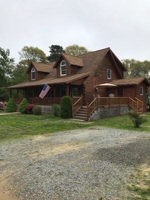 Exterior - Indulge in the ultimate vacation experience at this exquisite custom log home.  (Oak Bluffs)