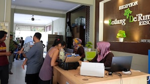 A reception desk with a sign reading "Reception Redang De'Rimba Resort." - Redang De' Rimba Resort (Redang Island)
