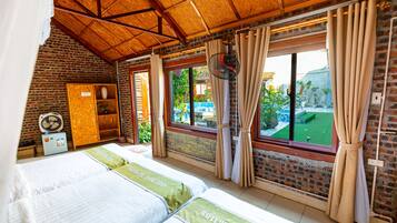 Comfort Triple Room, 1 Bedroom, Garden View | 1 bedroom, minibar, desk, laptop workspace