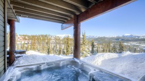A hot tub with a view of snow-covered mountains and trees. - Mountain Views, Steps from the Lifts (Big Sky)