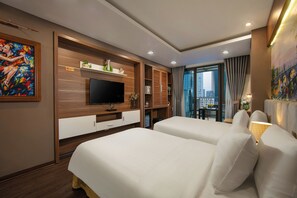 A hotel room with two beds, a TV, wooden paneling, and a city view. - Brilliant Me Tri Hotel (Hanoi)