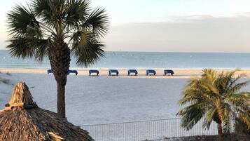 On the beach, sun loungers, beach umbrellas, beach towels