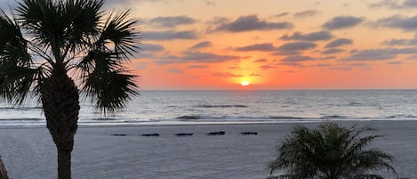 On the beach, sun-loungers, beach umbrellas, beach towels