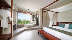 A modern bedroom with a four-poster bed, a bench, a vanity, and a window with a view of greenery. - Bayon Modern Residence (Siem Reap)